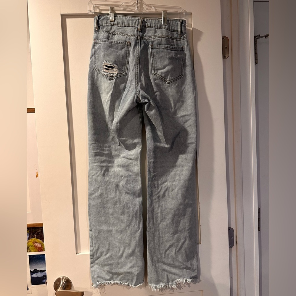 Gianni Bernini blue jeans with knee rips/ holes